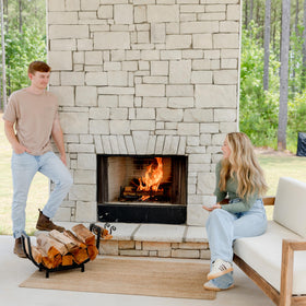 FireProof Pros raised-base design drying logs near the fire