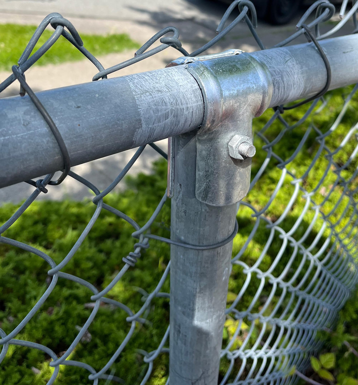 Firofend galvanized fence clamp ready for quick rail-to-post assembly.