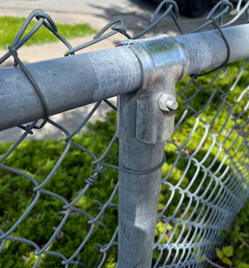 Firofend galvanized fence clamp ready for quick rail-to-post assembly.