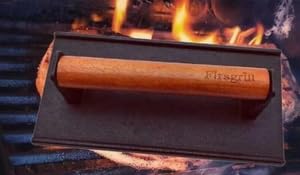 Firsgrill cast-iron press with wood handle close-up showing sturdy construction