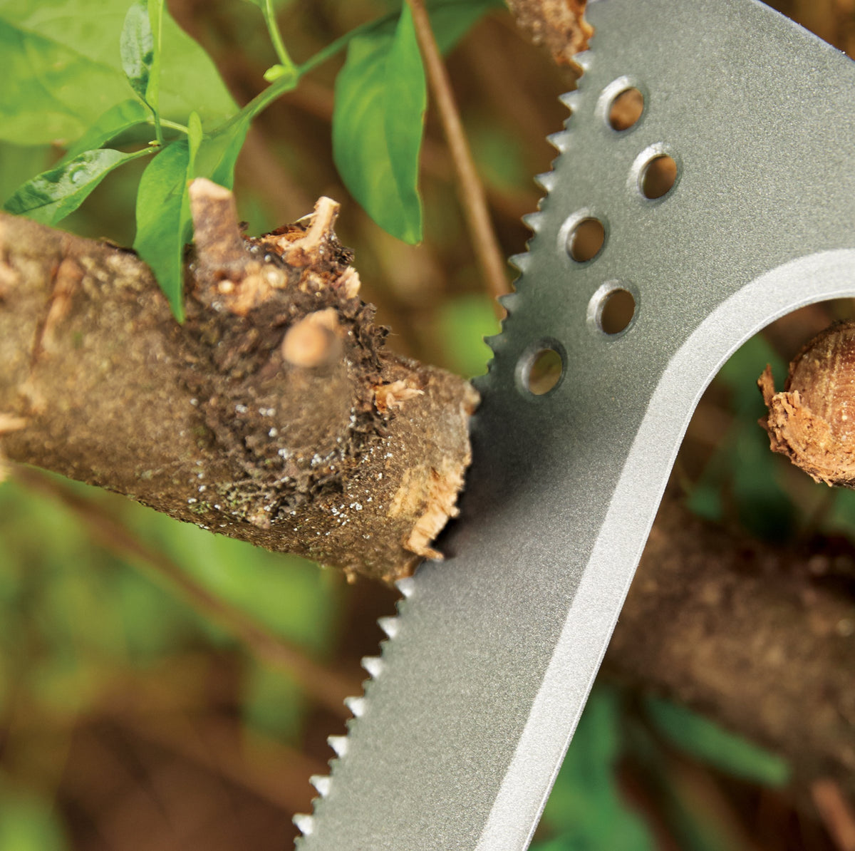 Fiskars Billhook Saw allows one-handed use while piling cuttings.