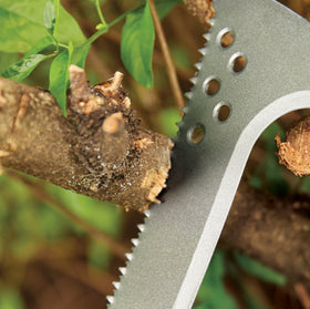 Fiskars Billhook Saw allows one-handed use while piling cuttings.