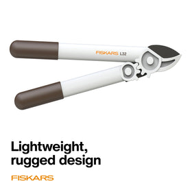 Bright, easy-to-spot Fiskars PowerGear Lopper design in a garden setting.