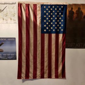 Flagolden heavy cotton flag with brass grommets and reinforced stitching outdoors.