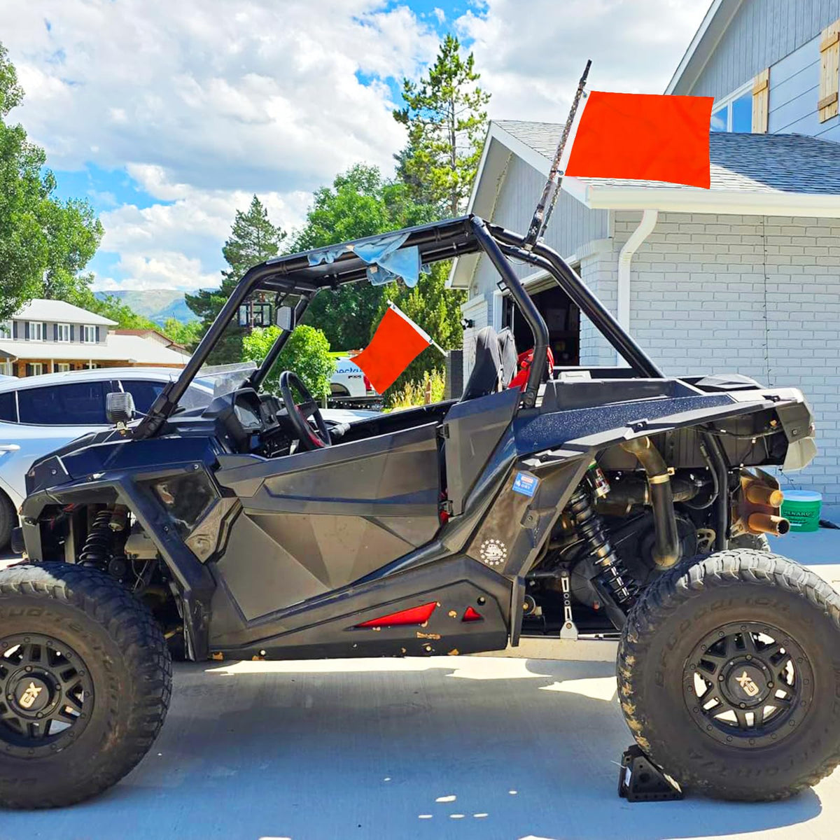 Flagolden orange flag attached to a boat improves daytime visibility and signaling.