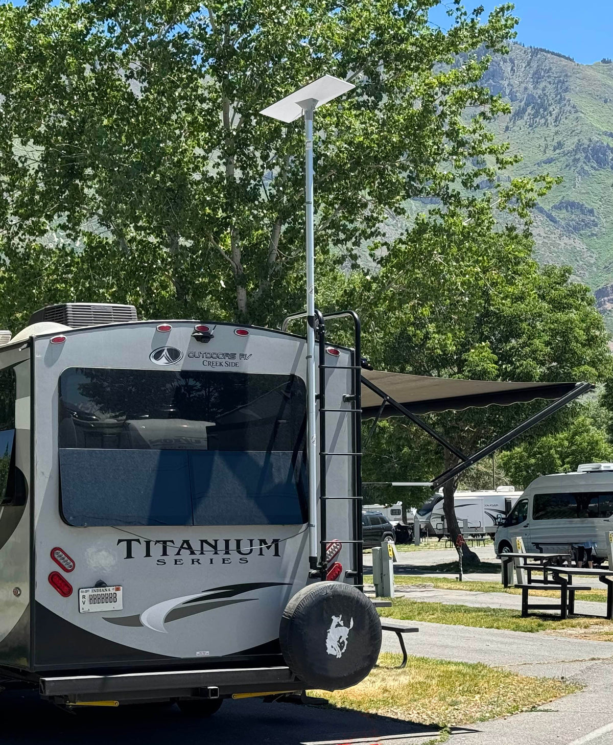 FlagPole Buddy demonstrates angle-from-ground installation for Starlink on an RV ladder.