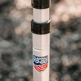Flagpole-To-Go anti-furl clips secure a 3x5 flag during outdoor events.
