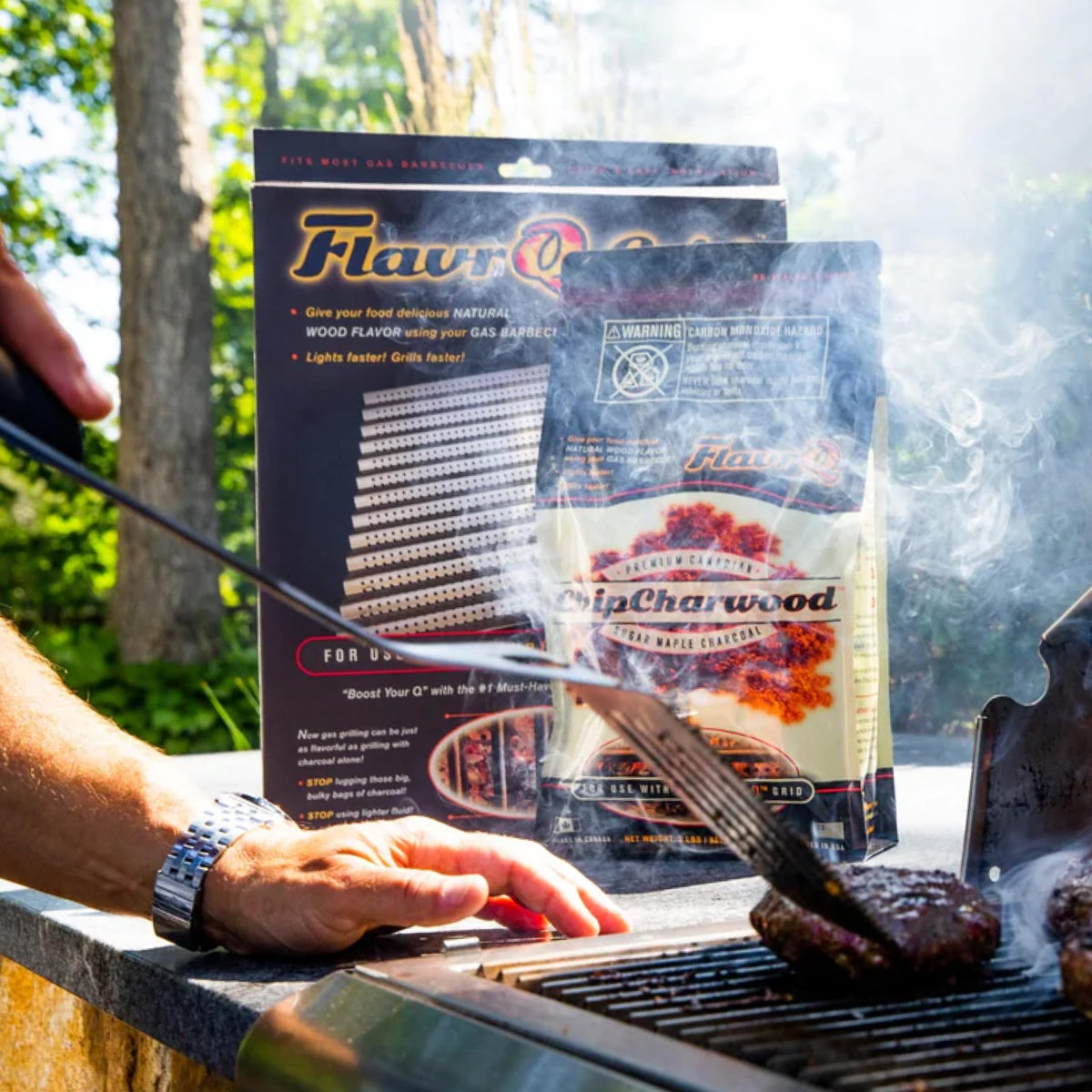 Tailgate camping setup with FlavrQ charcoal chips.