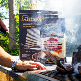 Tailgate camping setup with FlavrQ charcoal chips.