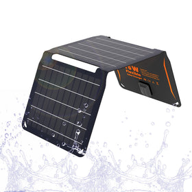 FlexSolar 15W foldable solar panel charging a phone in sunlight