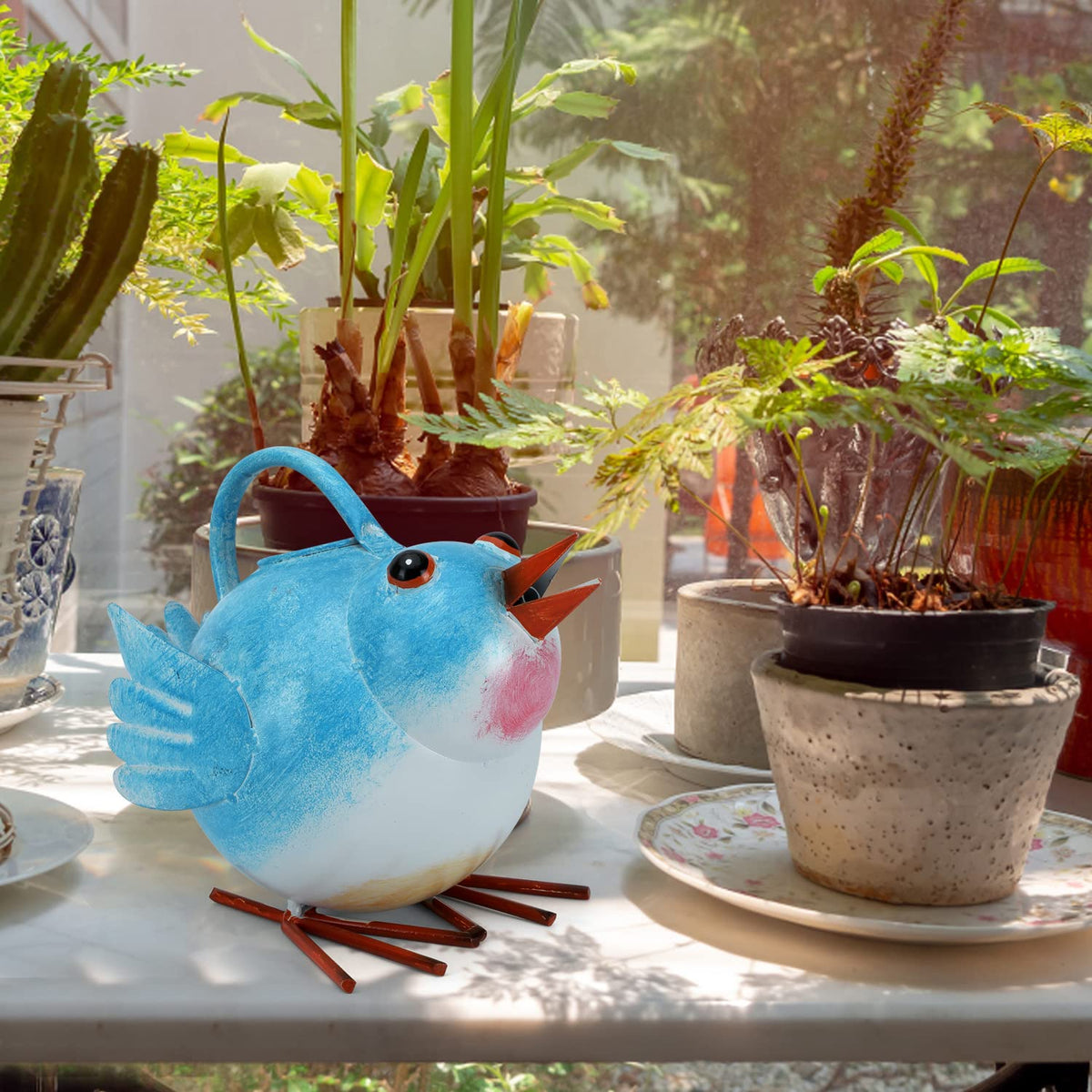 FLHJYF Decorative garden kettle doubles as charming plant decor.