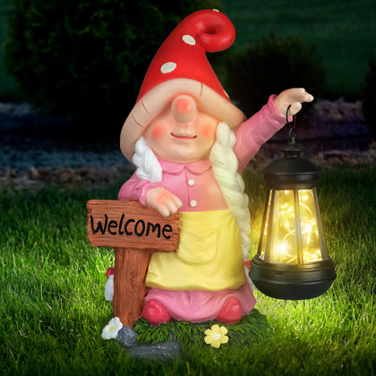 FLJZCZM solar garden gnome with welcome sign greets guests at night.