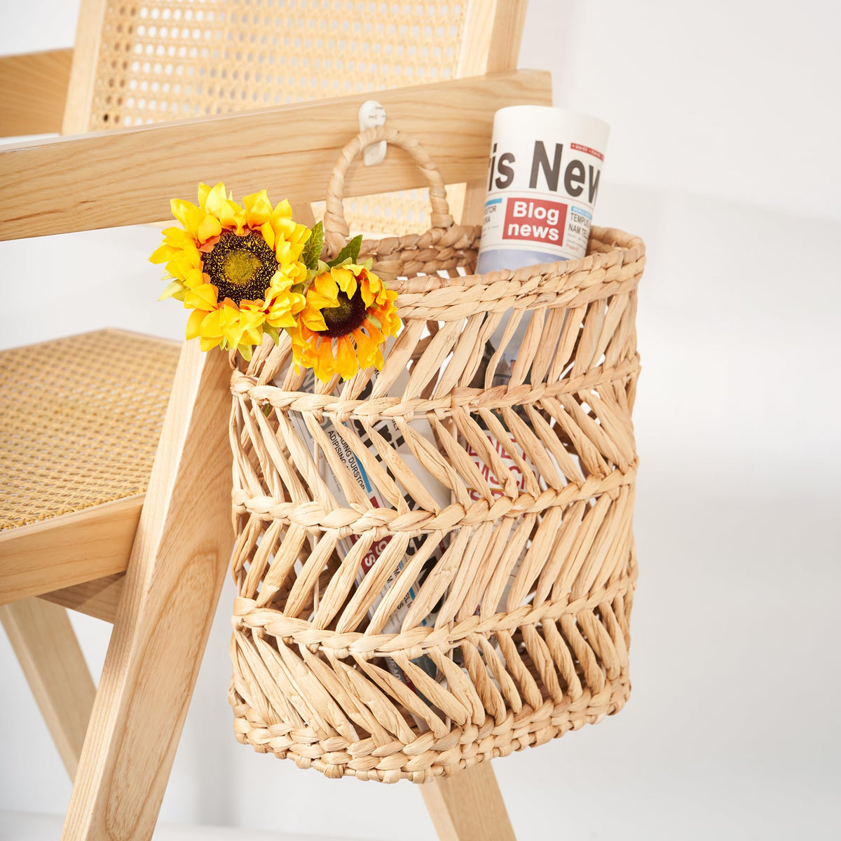 Daily mail organizer using Floramill hanging basket beside an entryway.
