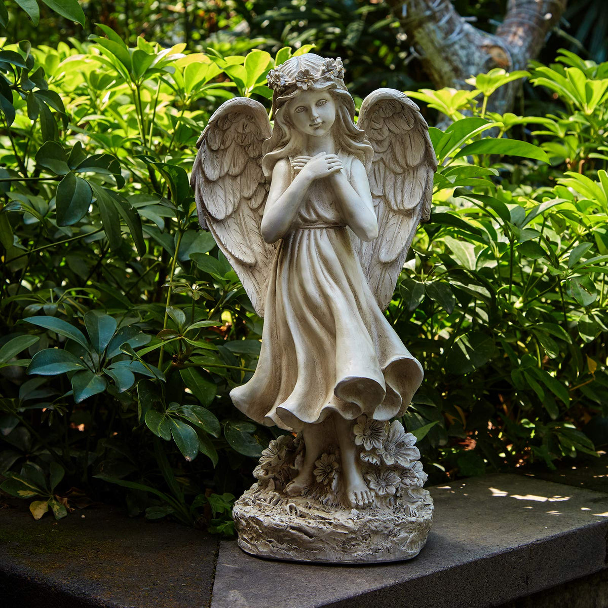 Floryden dusk-lit angel figurine creates peaceful nighttime garden charm.
