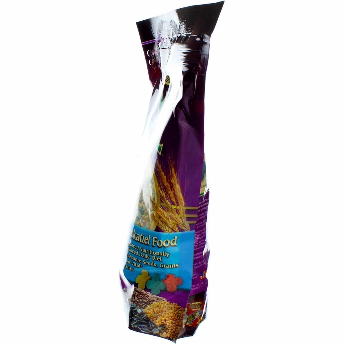 Packaging of F.M. Browns Wildbird Encore Cockatiel Food rests on a kitchen counter.