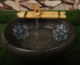 Foci Cozi bamboo water fountain with three-arm spouts for serene zen ambiance.