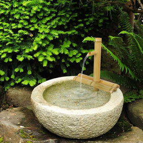 Foci Cozi bamboo fountain delivers soothing water sounds for relaxation.