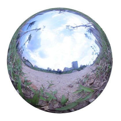 Folytiy gazing ball garden reflection shows elegant outdoor decor.