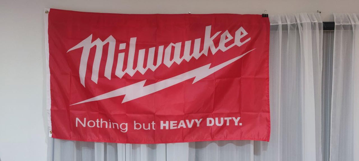 Iconic Milwaukee Tools logo and slogan on flag banner for brand allegiance