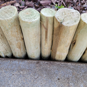 FOREVER BAMBOO natural wood texture for garden edge appeal.