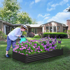 Foxlang black outdoor planter in garden setting, blending with outdoor decor.