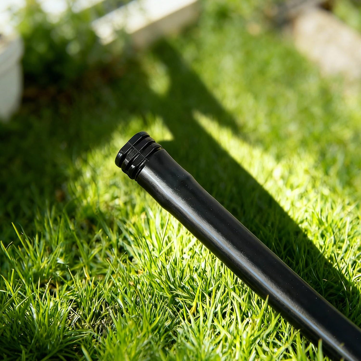 FoxRose end cap on 1/2-inch tubing, compatible with common drip lines.