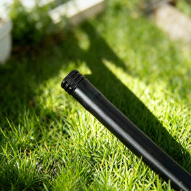 FoxRose end cap on 1/2-inch tubing, compatible with common drip lines.
