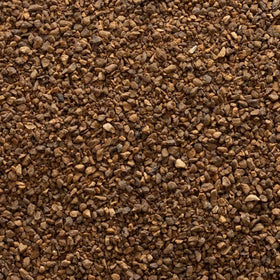 Frontier Co-op roasted dandelion root granules steeping into tea, offering earthy notes.