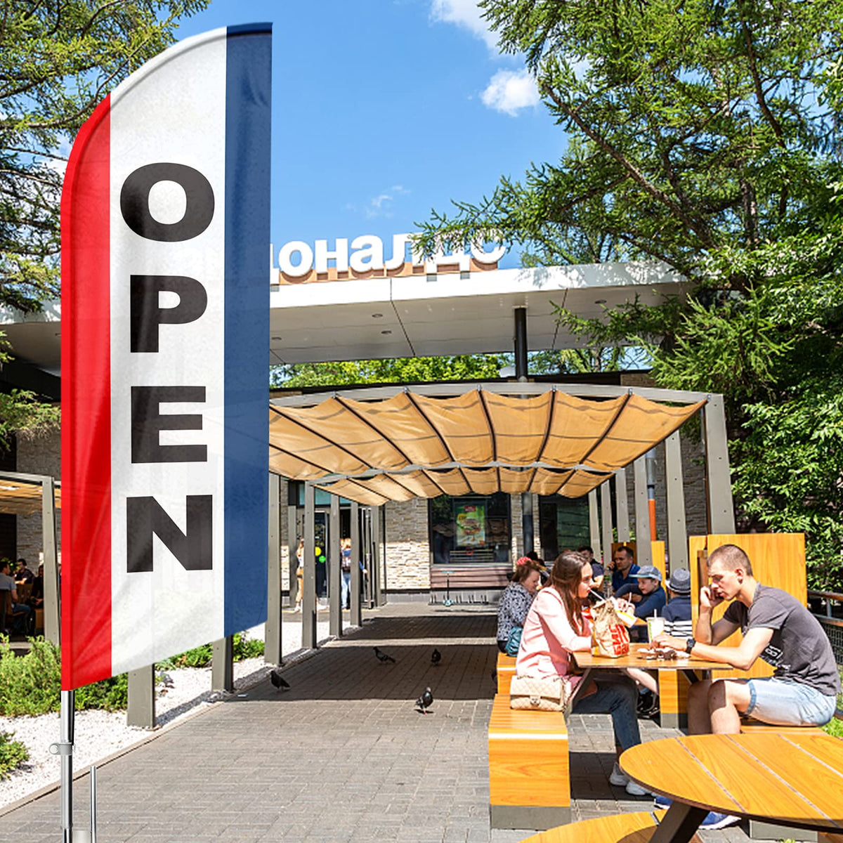 Open feather banner by FSFLAG is ideal for outdoor advertising at events.