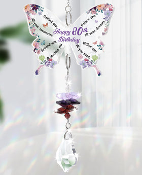 Funnli butterfly crystal suncatcher creates rainbow reflections on a sunlit window