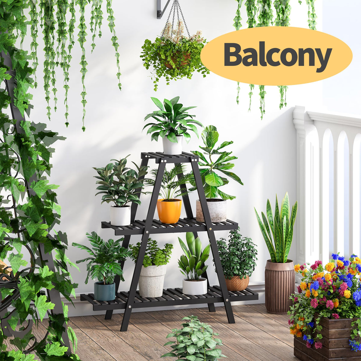 Indoor decor scene featuring Furshus bamboo plant stand in black finish.