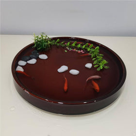 Fzfeiyy round plant tray suitable for indoor and outdoor placement.