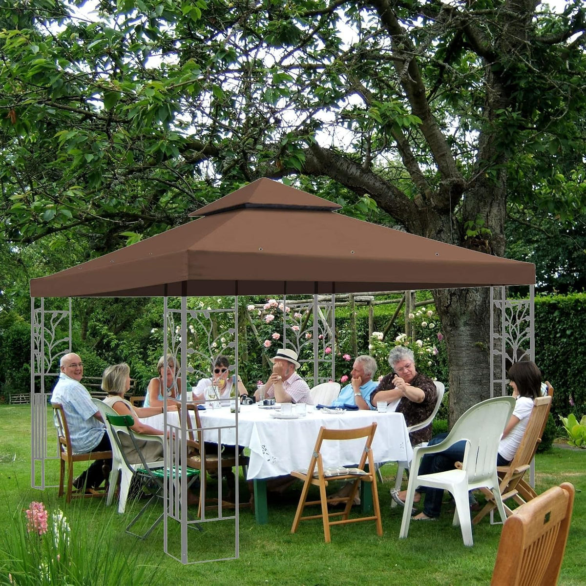 Ganggend canopy top over a grill setup for wind-resistant shade.