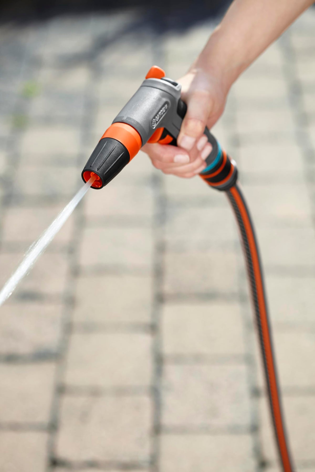 Gardena cleaning nozzle demonstrating adjustable spray pattern for versatile cleaning