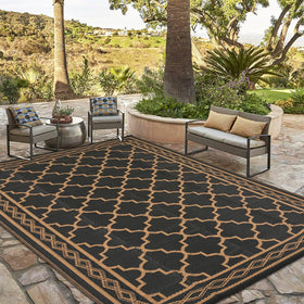 Garvee 9x18 outdoor rug folded for compact storage during travel.