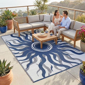 Garvee Outdoor Rug 8x10 with boho sun pattern on a deck, easy to clean.
