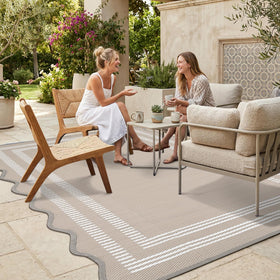 Garvee waterproof outdoor rug with scalloped edge on a patio, durable and easy to clean