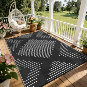 Garvee 5x8 waterproof outdoor rug in black and white, ideal for patios and decks, easy to clean.