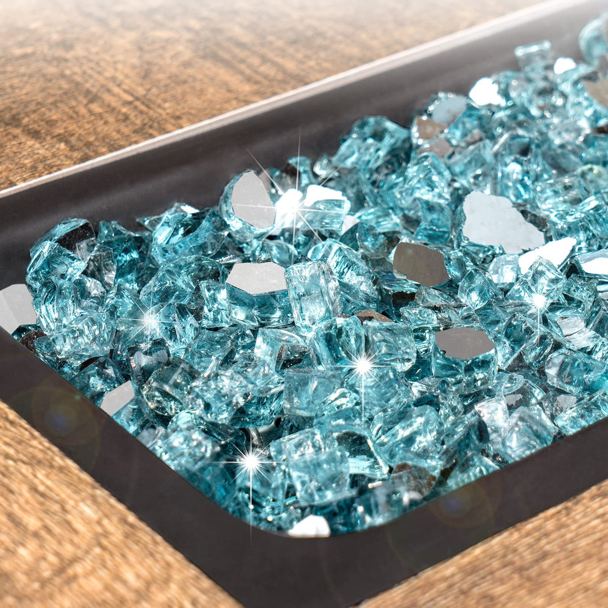 GASPRO fire glass with mirrored surface enhances daytime sparkle and evening glow.