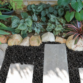 GASPRO outdoor landscaping pebbles in deep black finish