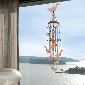 GDNSFIT duck wind chimes in a lush garden setting for curb appeal.