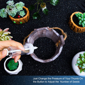 Geiserailie seed dispenser in use planting seeds in a pot.