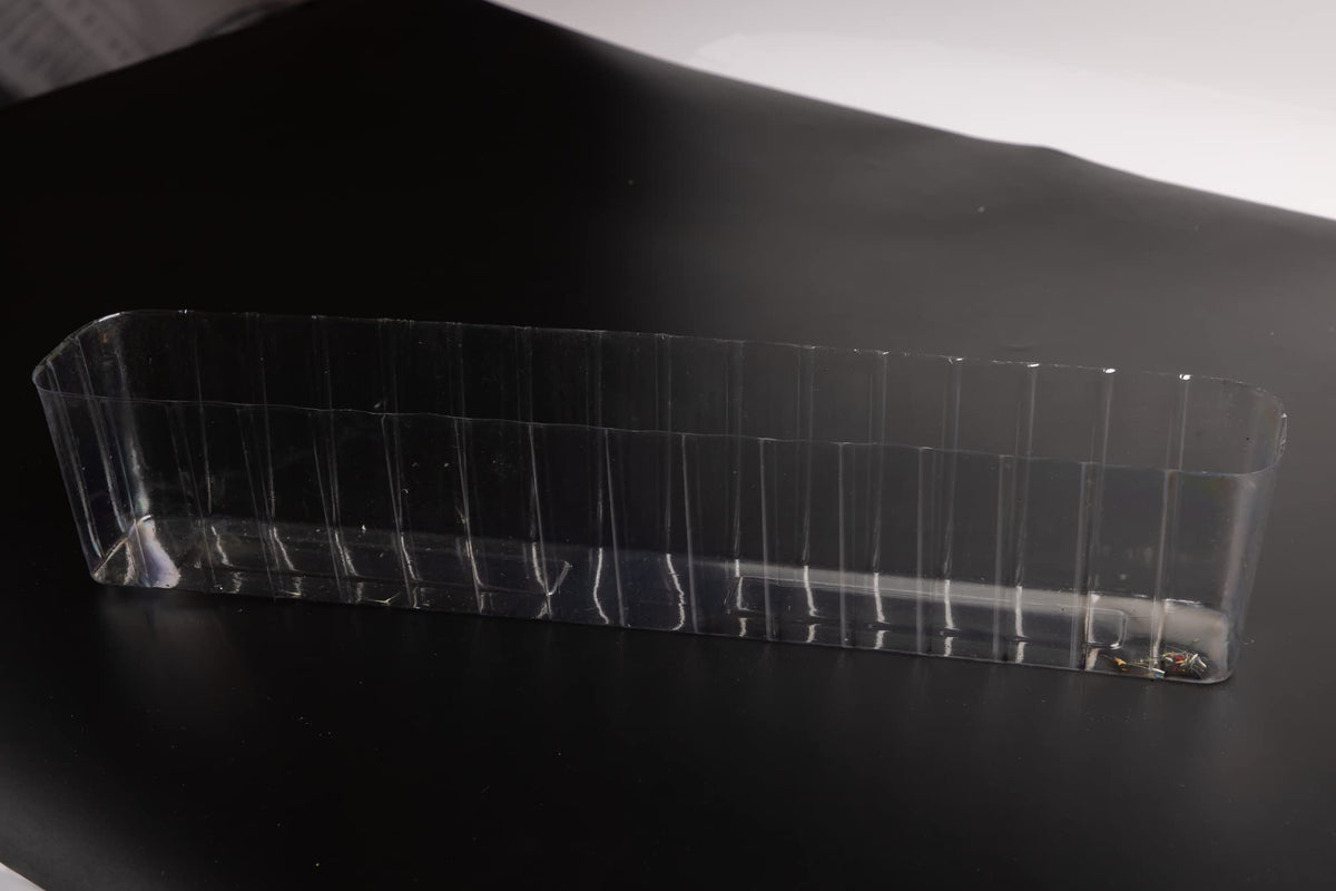 Generic clear liner inside a wooden planter helps keep soil contained and surfaces clean