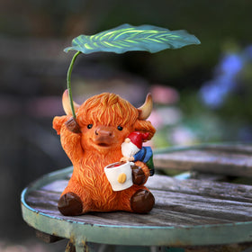 Generic gift-ready garden gnome Highland cattle offers unique charm for gifting.