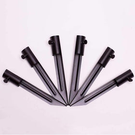 Generic metal ground spike keeps flags upright along walkways and lawns for tidy displays.
