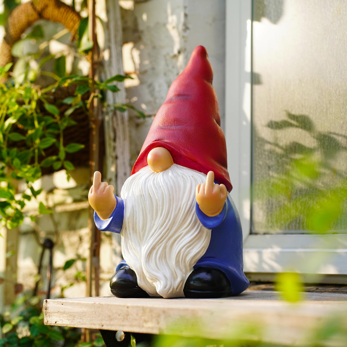 Generic Middle Finger Gnome weather-resistant poly-resin for outdoor durability.
