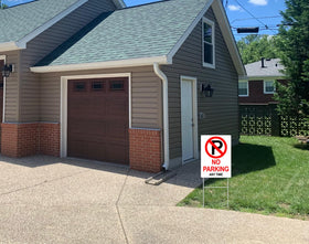 Generic No Parking sign easy to install by sinking posts into soil.