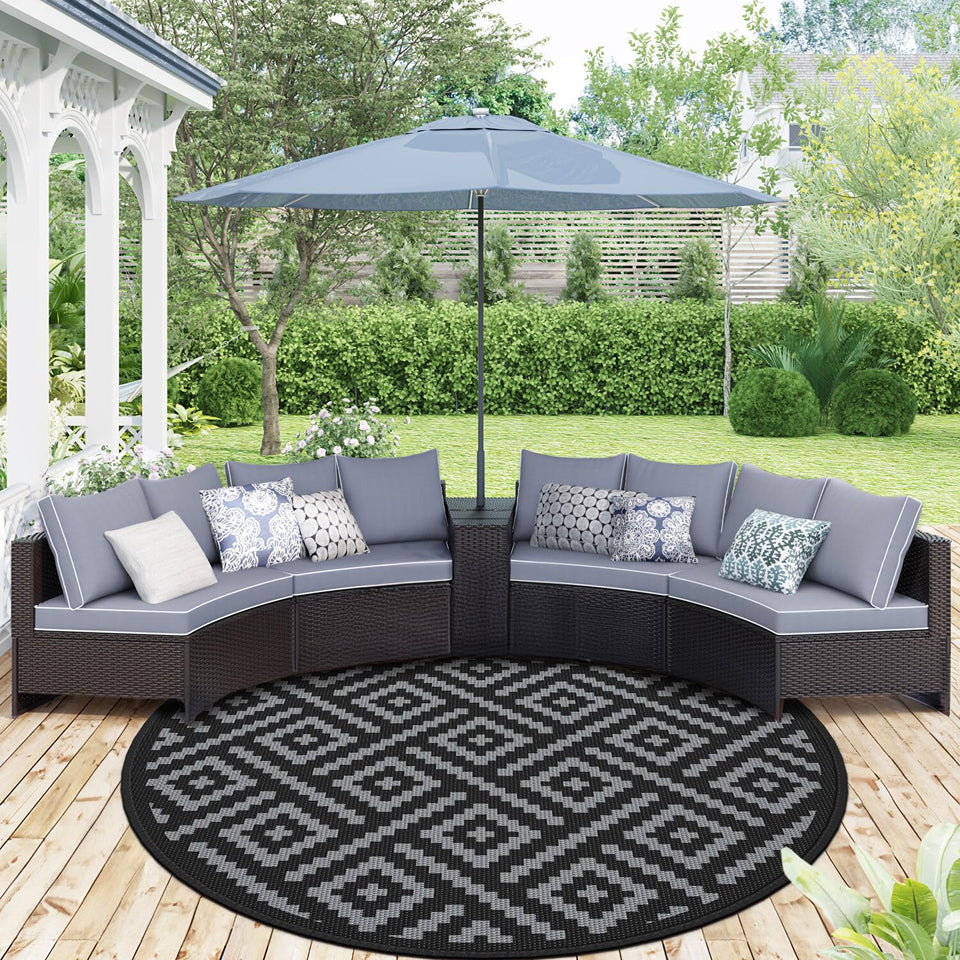 GENIMO 10ft round outdoor rug on patio with reversible two-tone design.