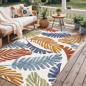 GENIMO leaf-pattern rug on patio adds boho style and comfort.