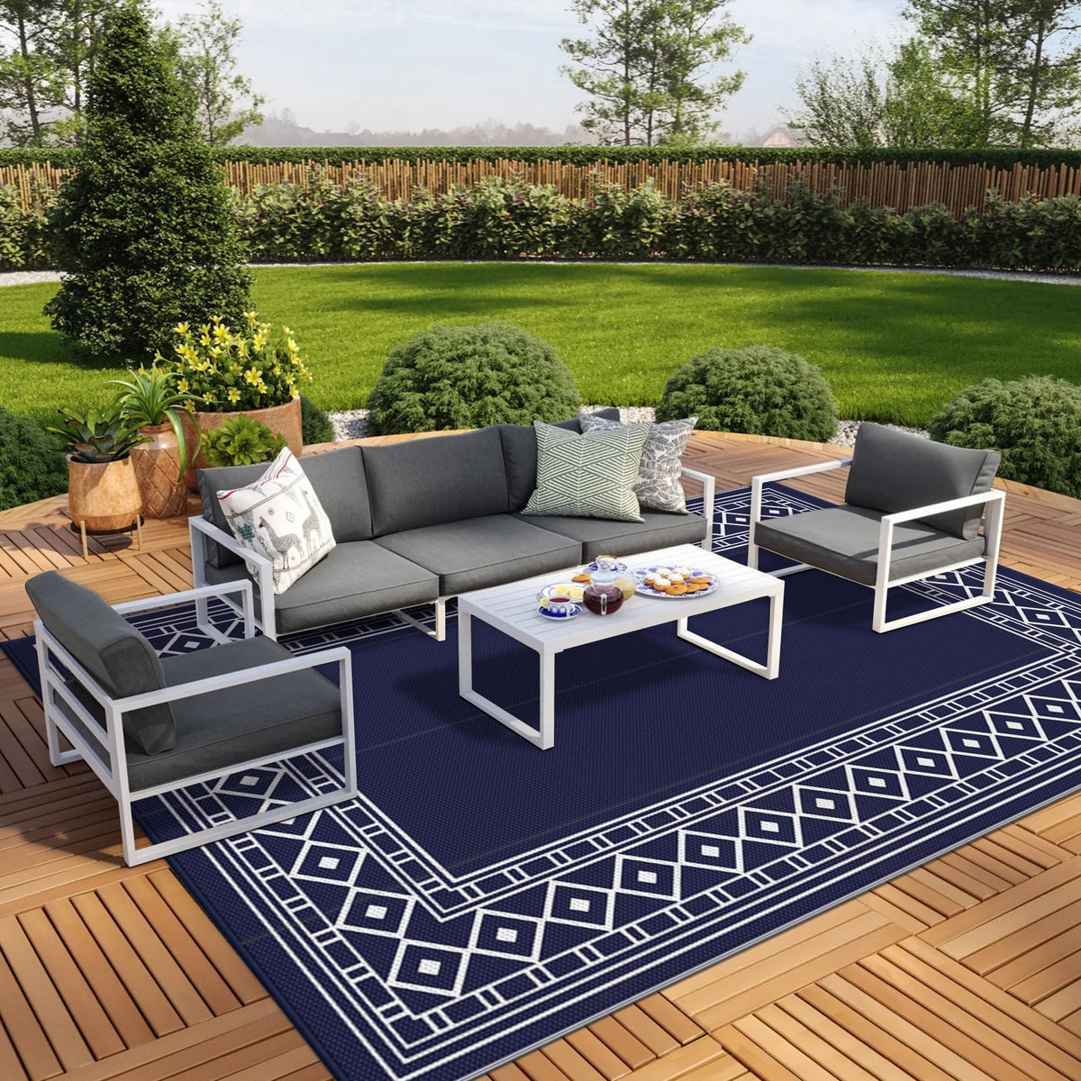 GENIMO outdoor rug 10x14 in blue and white, weatherproof for patios and RVs.